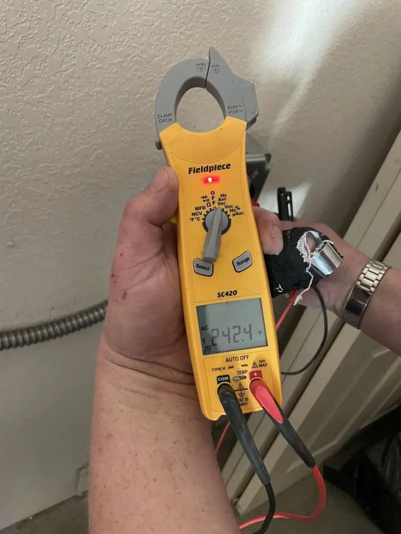 Voltage testing with clamp meter during Outlet Installation in Brookdale